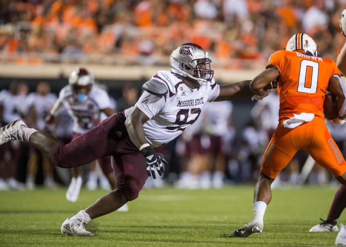 Missouri State defensive lineman Eric Johnson (93) reaches for Oklahoma State running back LD Brown (0). Mandatory Credit: Brett Rojo-USA TODAY